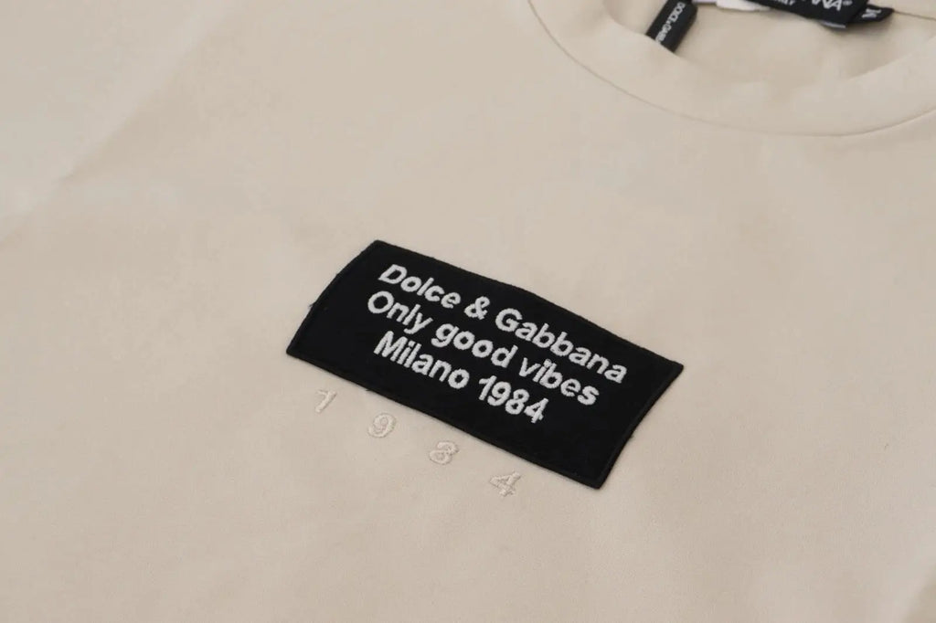 Sweatshirt dolce & gabbana ivoire en coton avec patch noir brodé et année 1984 imprimée sur le devant
