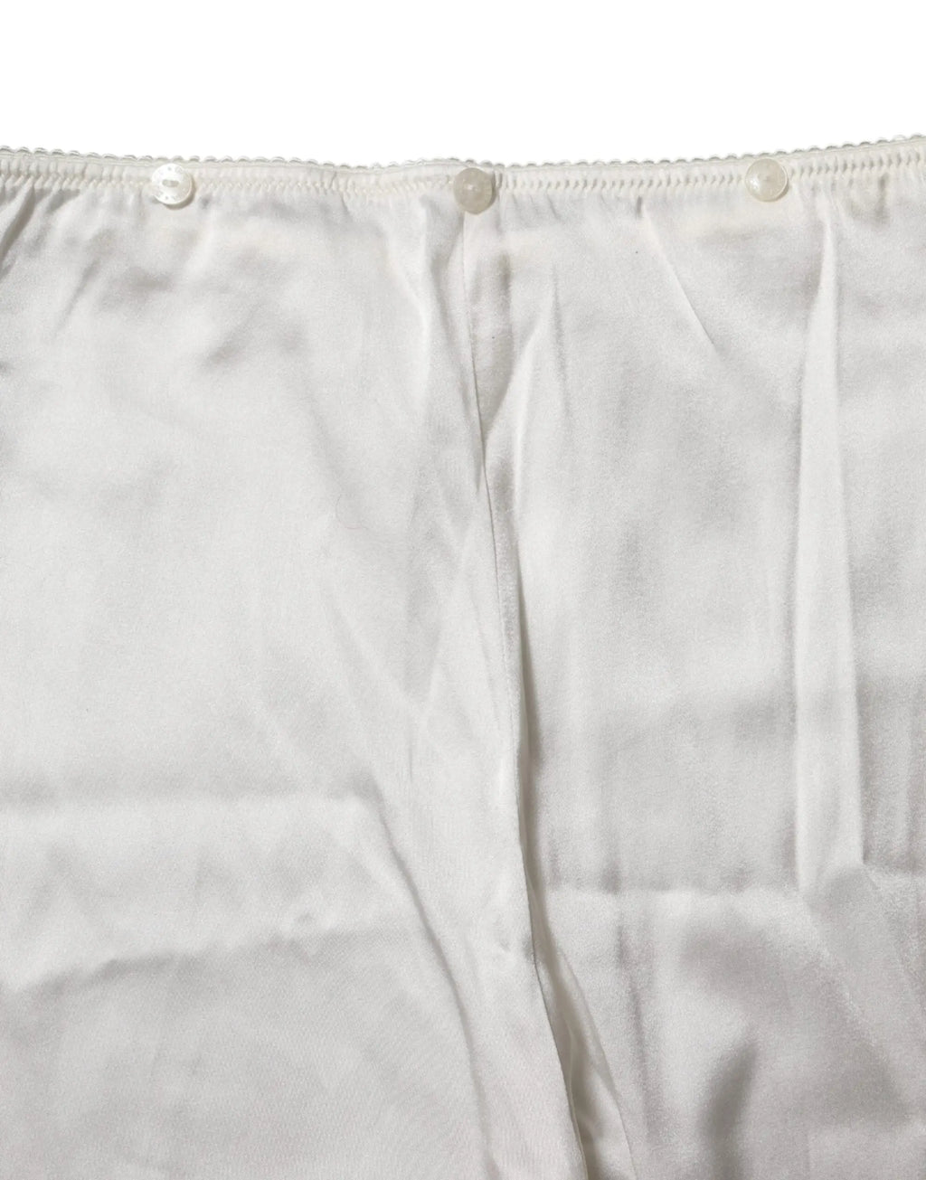 Rideau blanc en coton avec bord festonné et trois boutons assortis pour pantalon tapered taille haute ivoire en soie dolce & gabbana