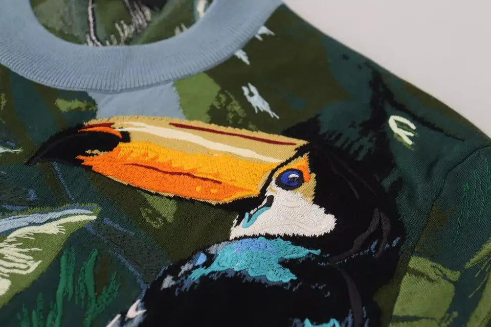 Pull-over dolce & gabbana en laine et soie vert camouflage avec toucan brodé vibrant à bec orange et jaune