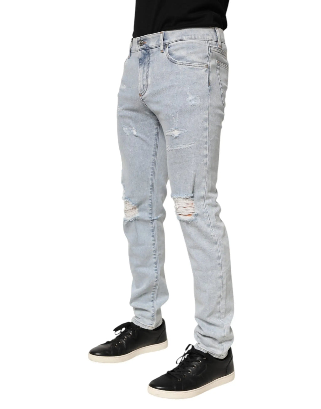 Jean slim fit bleu clair en denim délavé avec genoux déchirés et usés dolce gabbana