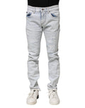 Jean skinny délavé clair dolce & gabbana en denim avec détails déchirés aux genoux et cuisses