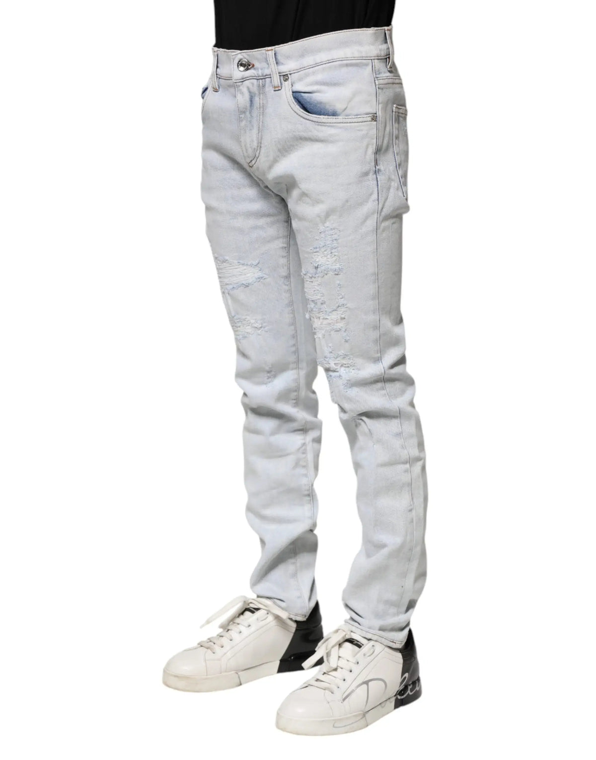 Jean skinny bleu clair en denim light wash dolce gabbana avec détails déchirés aux cuisses et genoux