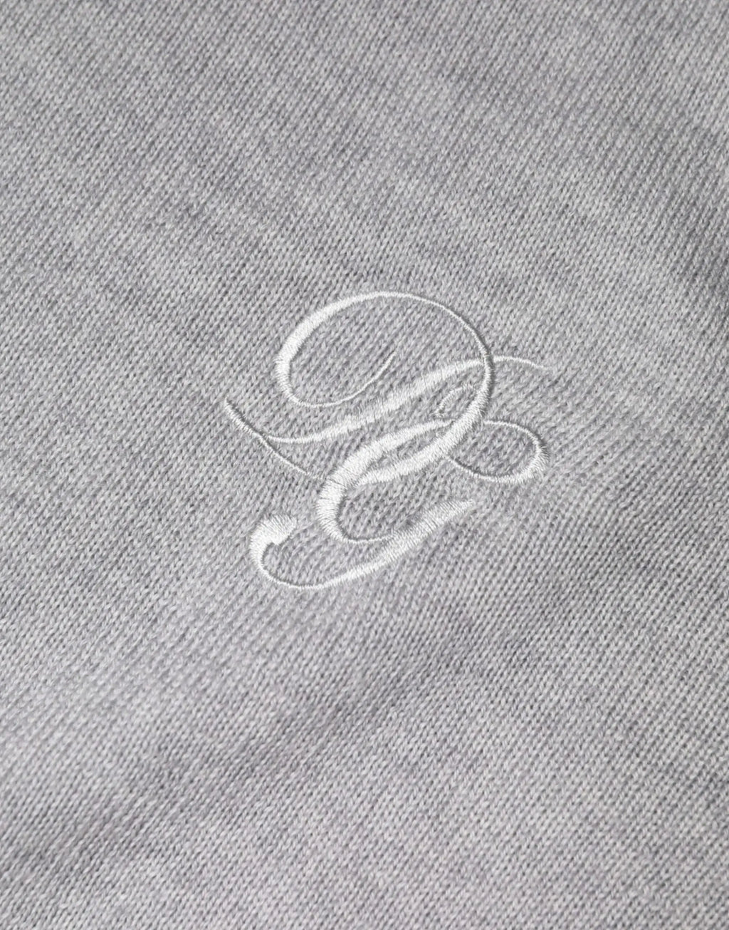 Polo en coton gris chiné avec logo blanc brodé poitrine pour doucé et gabbana pull en laine col rond gris clair