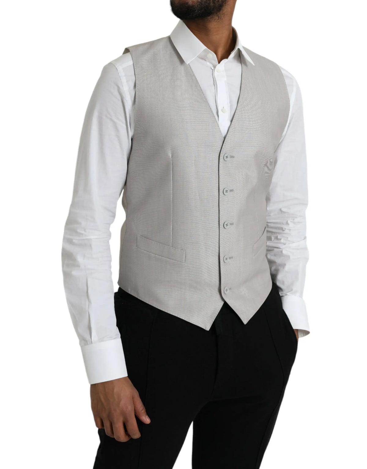Un gilet de costume formel dolce & gabbana en laine gris clair avec texture élégante boutons assortis et poches à rabat