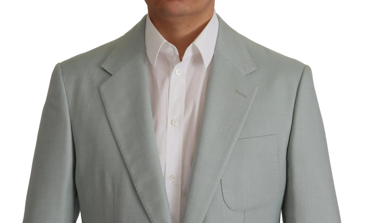 Blazer dolce & gabbana en cachemire soie vert clair porté sur chemise blanche boutonnée avec texture subtile gris clair