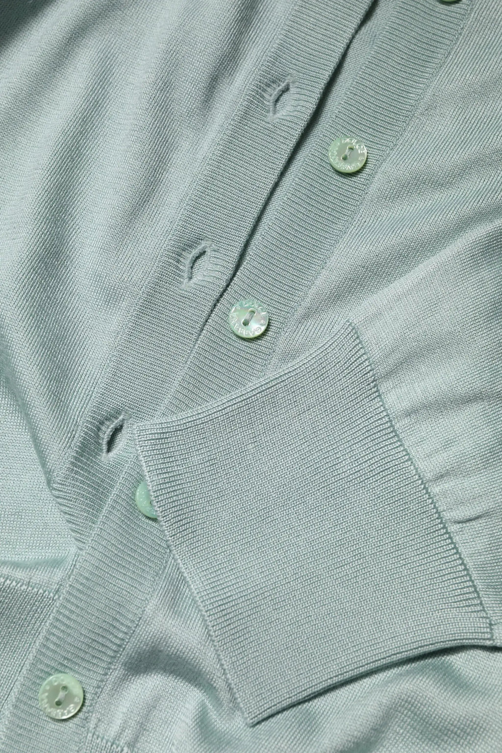 Cardigan dolce & gabbana en tricot côtelé bleu clair avec fermeture à boutons assortis en soie légère