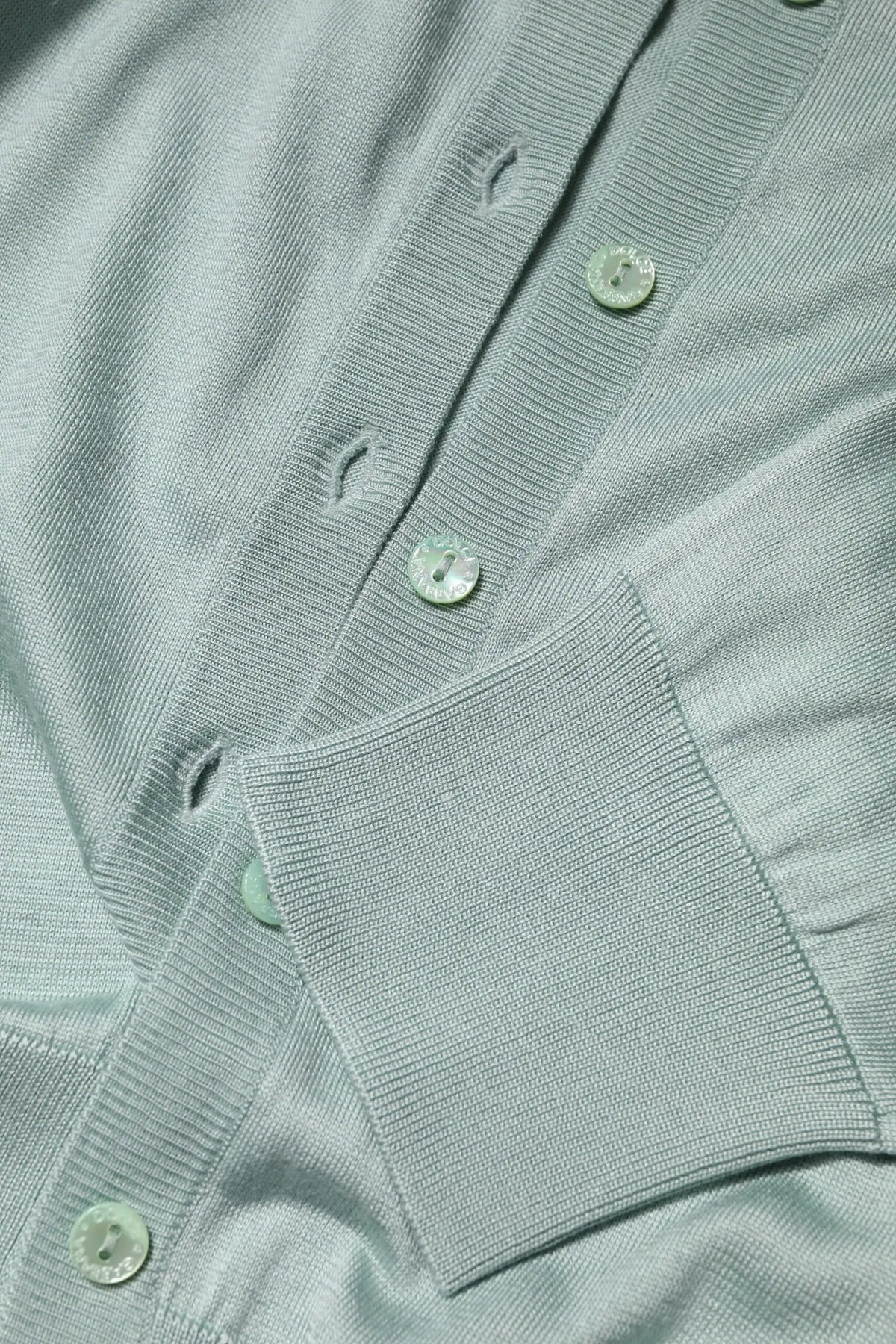 Cardigan dolce & gabbana en tricot côtelé bleu clair avec fermeture à boutons assortis en soie légère