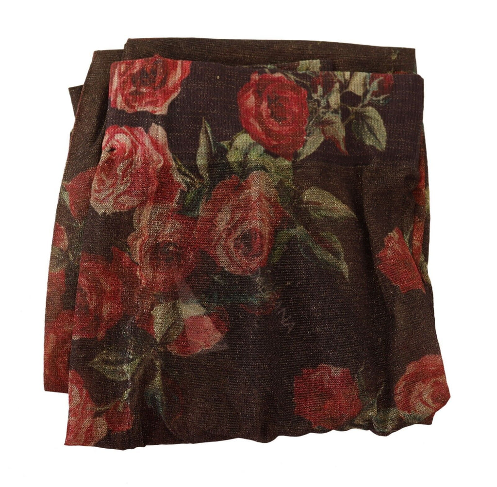 Collants en nylon noirs Dolce & Gabbana avec motif floral élégant, visibles sur le modèle.
