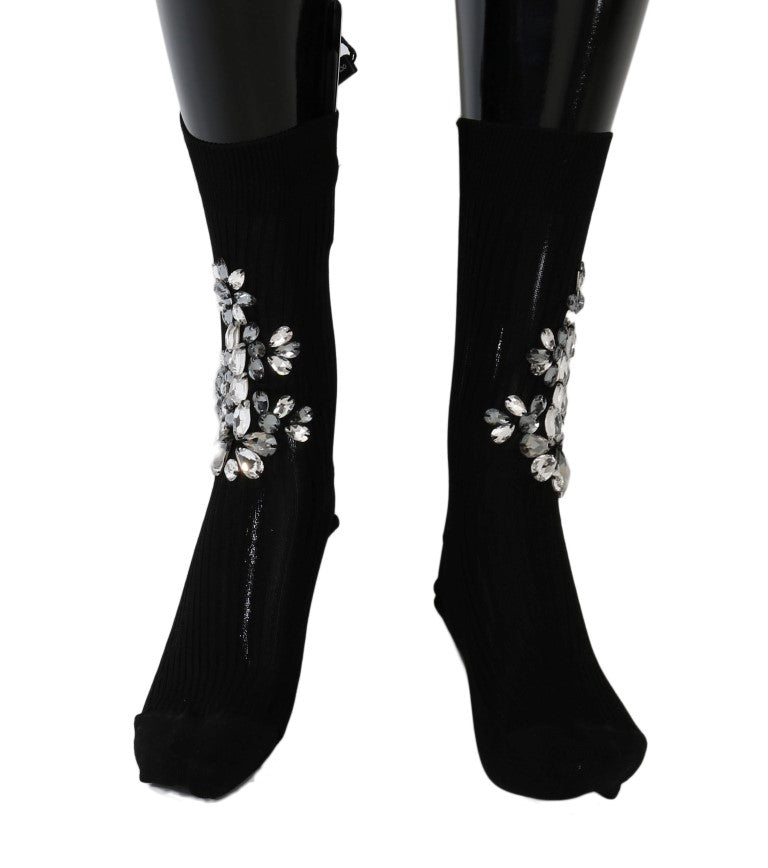 Chaussettes en maille noire Dolce & Gabbana avec motifs floraux et cristaux clairs, élégantes et raffinées.