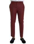 Une paire de pantalons slim en laine bordeaux riche avec un design classique et des plis subtils par dolce & gabbana