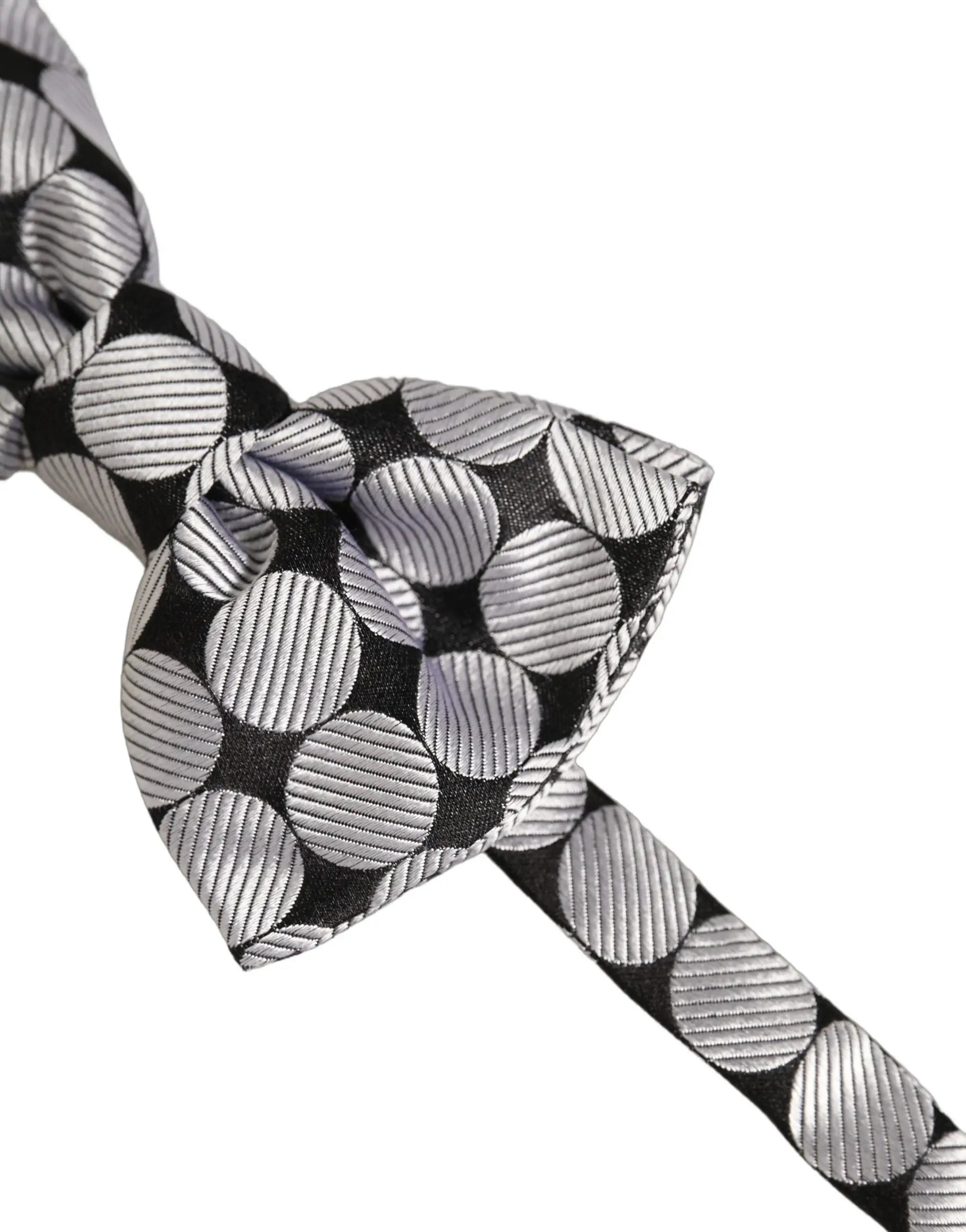 Un nœud papillon dolce & gabbana noir et argent ajustable avec motif de cercles texturés métallisés