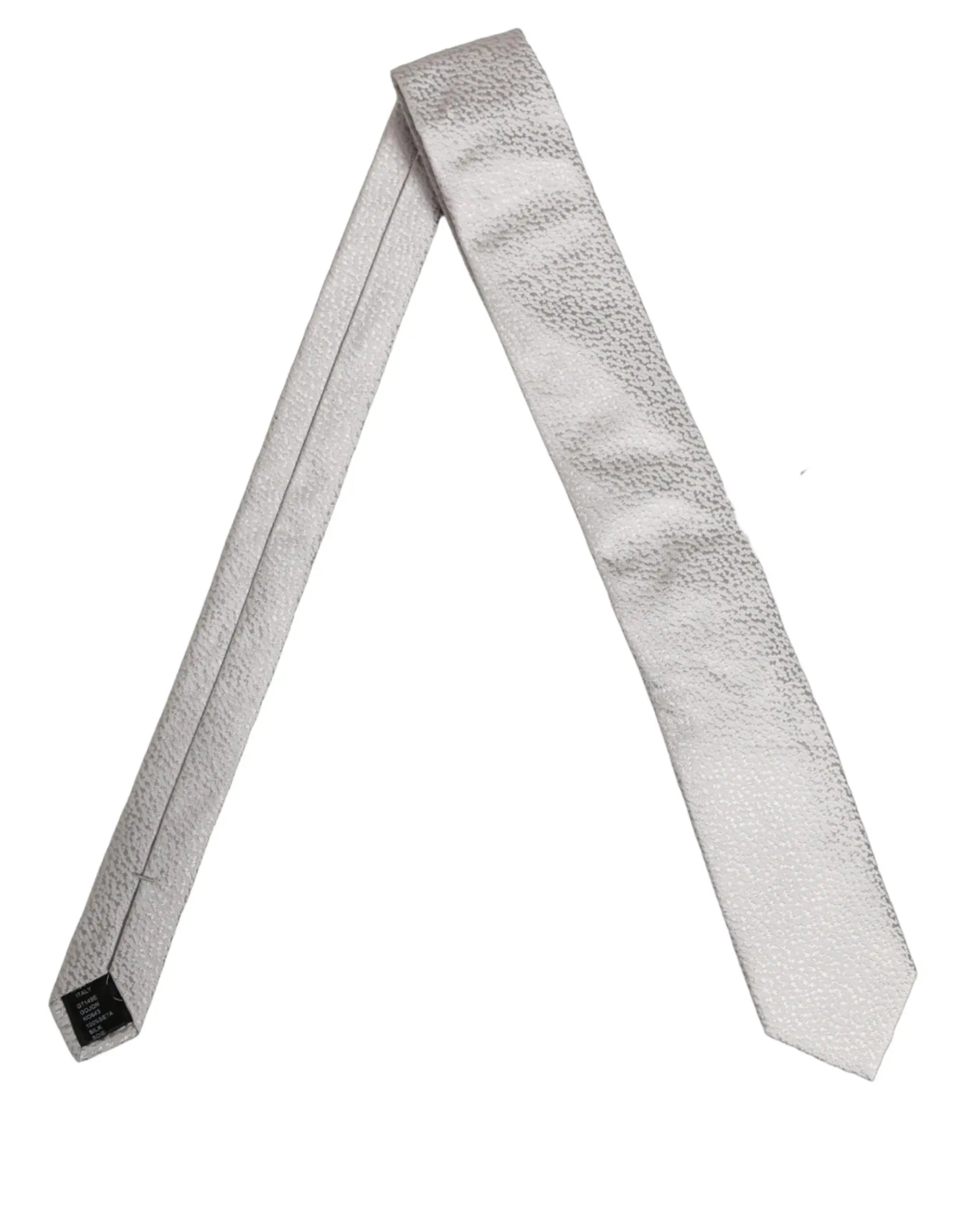 Une cravate dolce & gabbana pour homme gris en soie 100 avec motif texturé et tissu lisse semblable à la soie