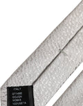 Cravate en soie grise texturée avec motif chevrons subtile dolce & gabbana pour homme fabriquée en italie