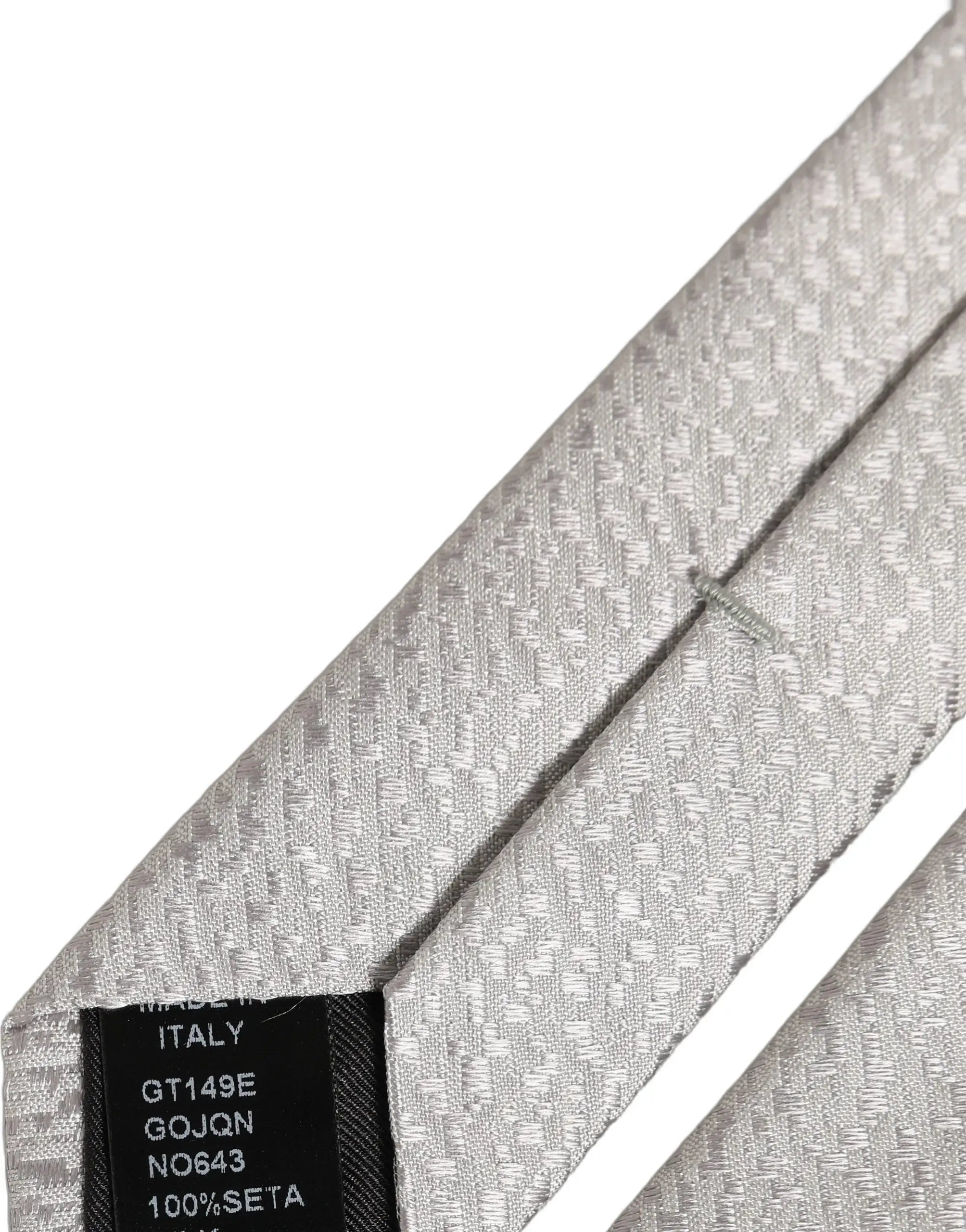 Cravate en soie grise texturée avec motif chevrons subtile dolce & gabbana pour homme fabriquée en italie