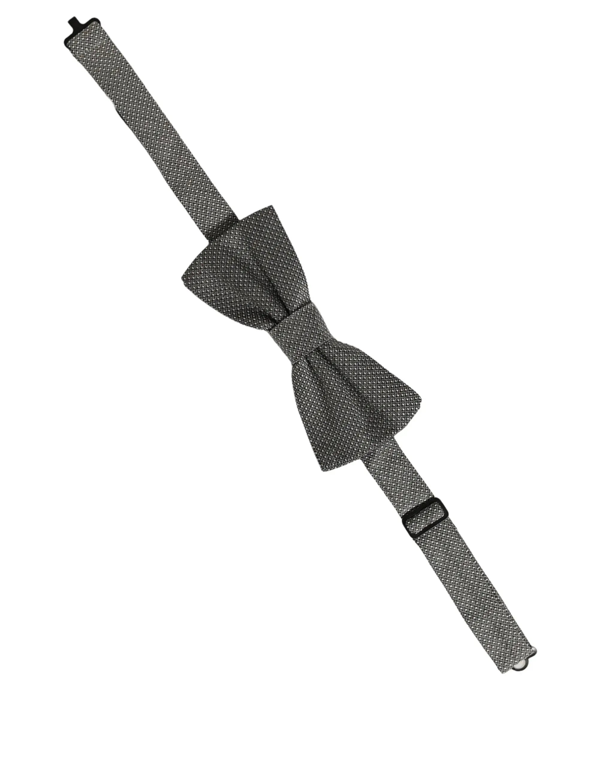 Un élégant nœud papillon dolce & gabbana en soie grise charbon avec motif texturé subtil et sangle réglable