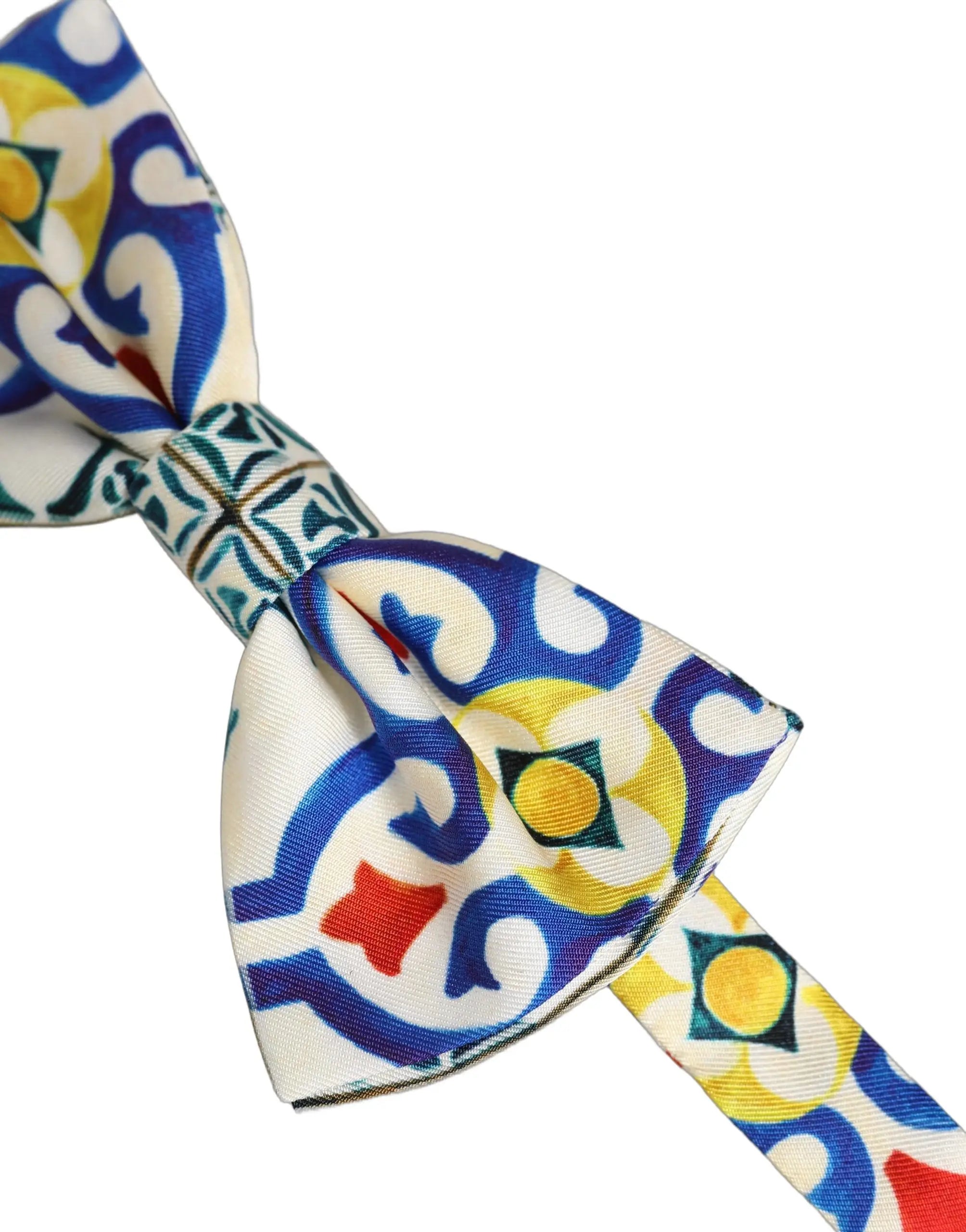 Dolce & gabbana homme papillon ajustable en tissu blanc avec motifs géométriques bleus jaunes et rouges vifs