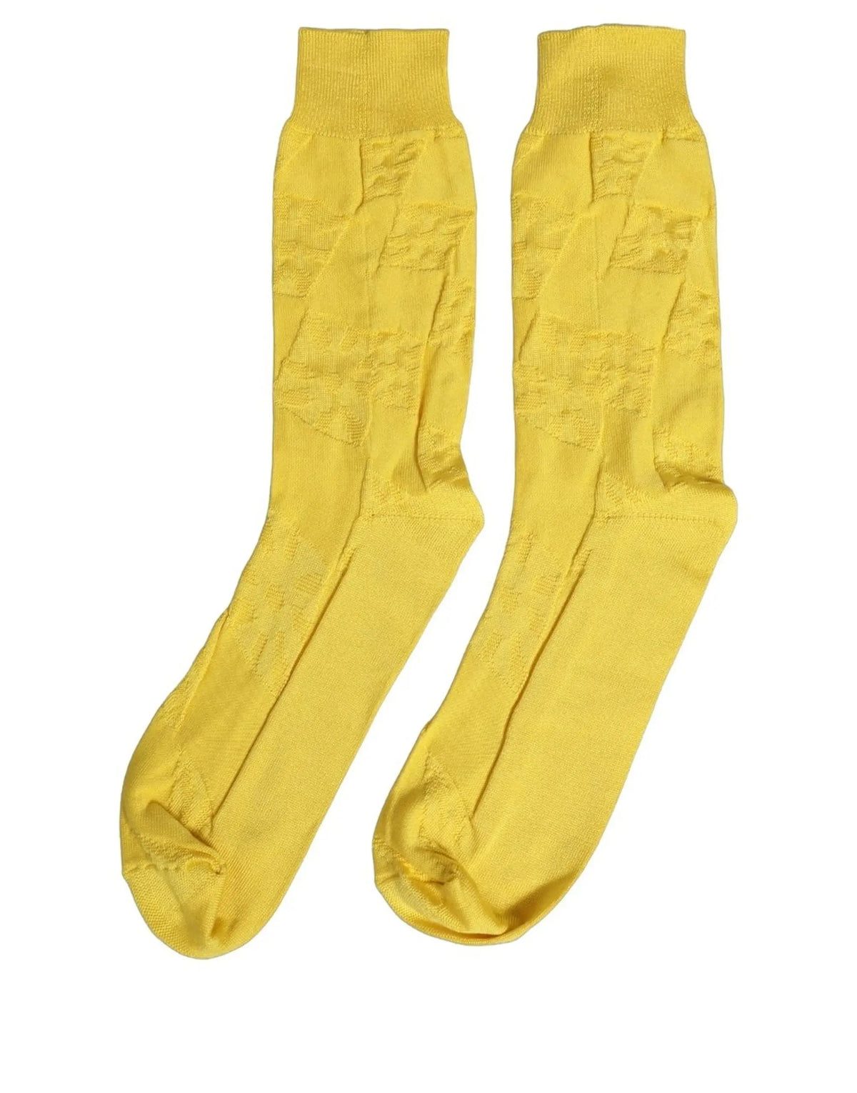 Une paire de chaussettes mi-mollet dolce & gabbana jaune en soie 100% avec un motif tricoté subtil