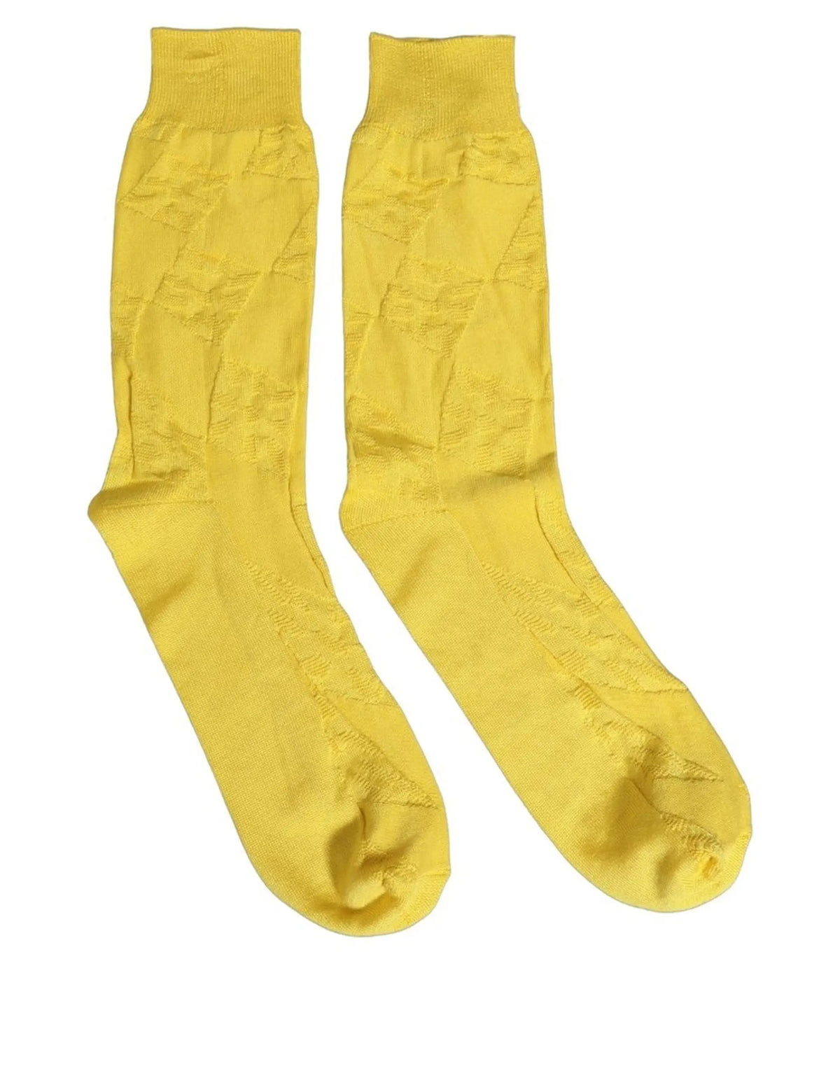 Une paire de chaussettes homme dolce & gabbana jaune en soie 100 pourcent avec motif texturé subtil mi-mollet