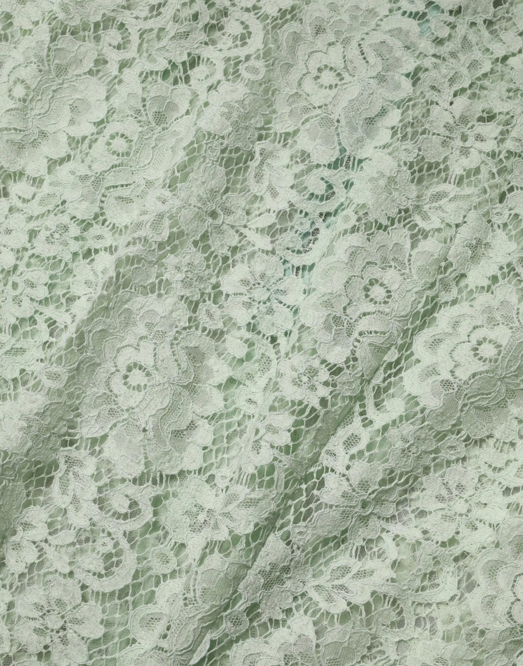 Tissu en dentelle florale blanche délicate avec broderies fines sur robe midi dolce & gabbana vert menthe