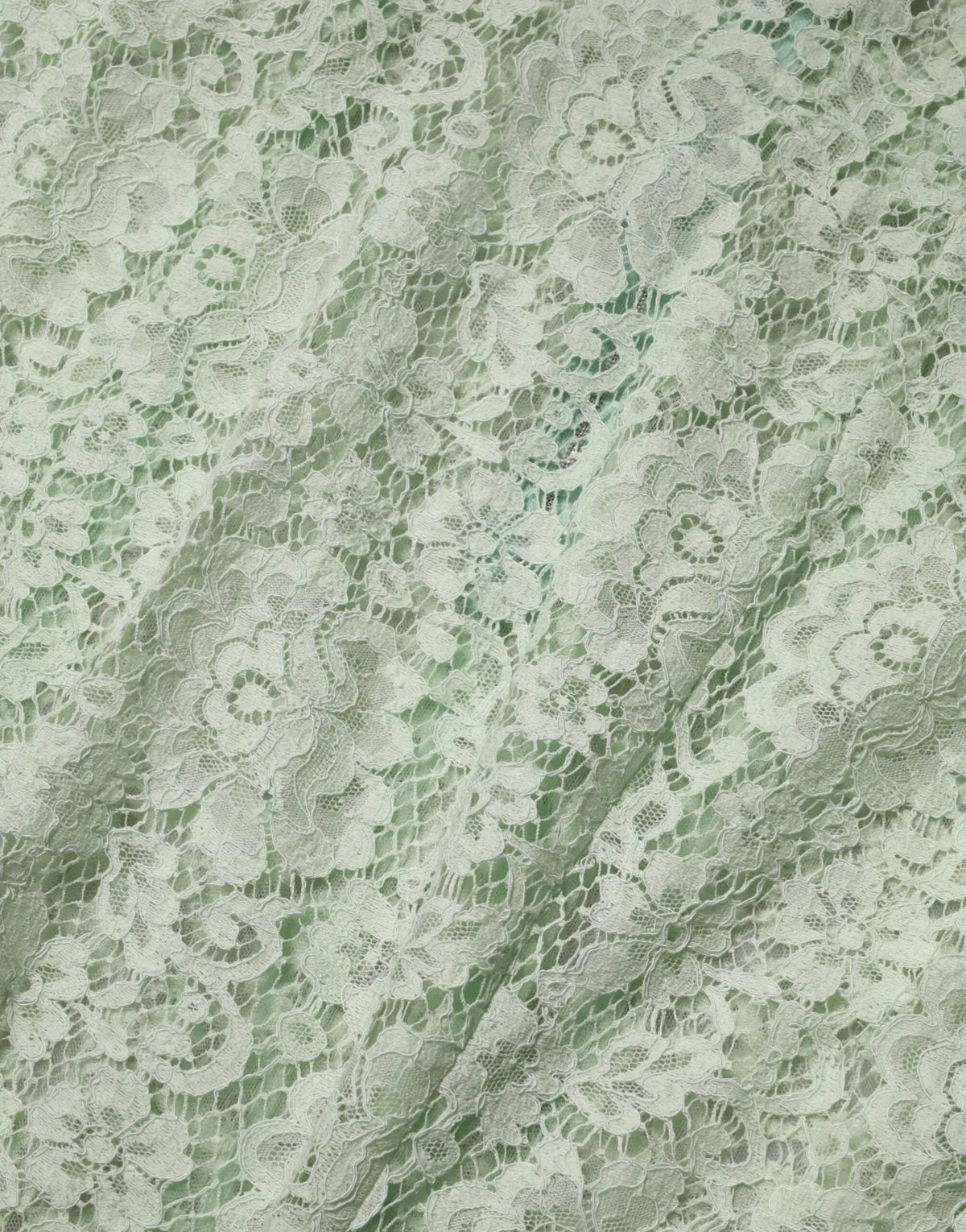 Tissu en dentelle florale blanche délicate avec broderies fines sur robe midi dolce & gabbana vert menthe
