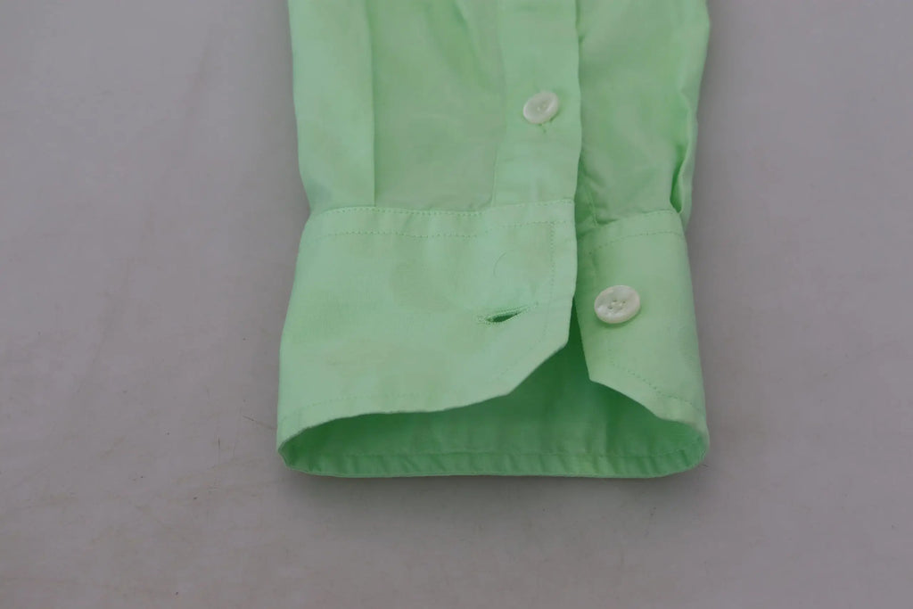 Chemise dolce & gabbana verte menthe à manches longues avec poignet boutonné vert clair et tissu plié soigneusement