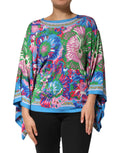 Dolce gabbana tunique blouse imprimée florale multicolore avec silhouette cape fluide en bleu vert rose et violet éclatants