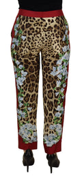 Pantalon dolce & gabbana mi taille imprimé léopard rouge et beige avec broderie florale blanche sur les côtés