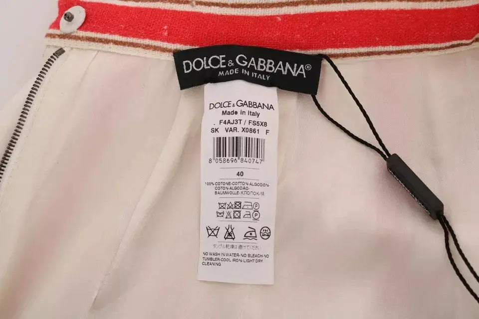 Jupe midi en coton blanc dolce & gabbana avec ceinture rayée rouge et beige et étiquette de la marque visibles