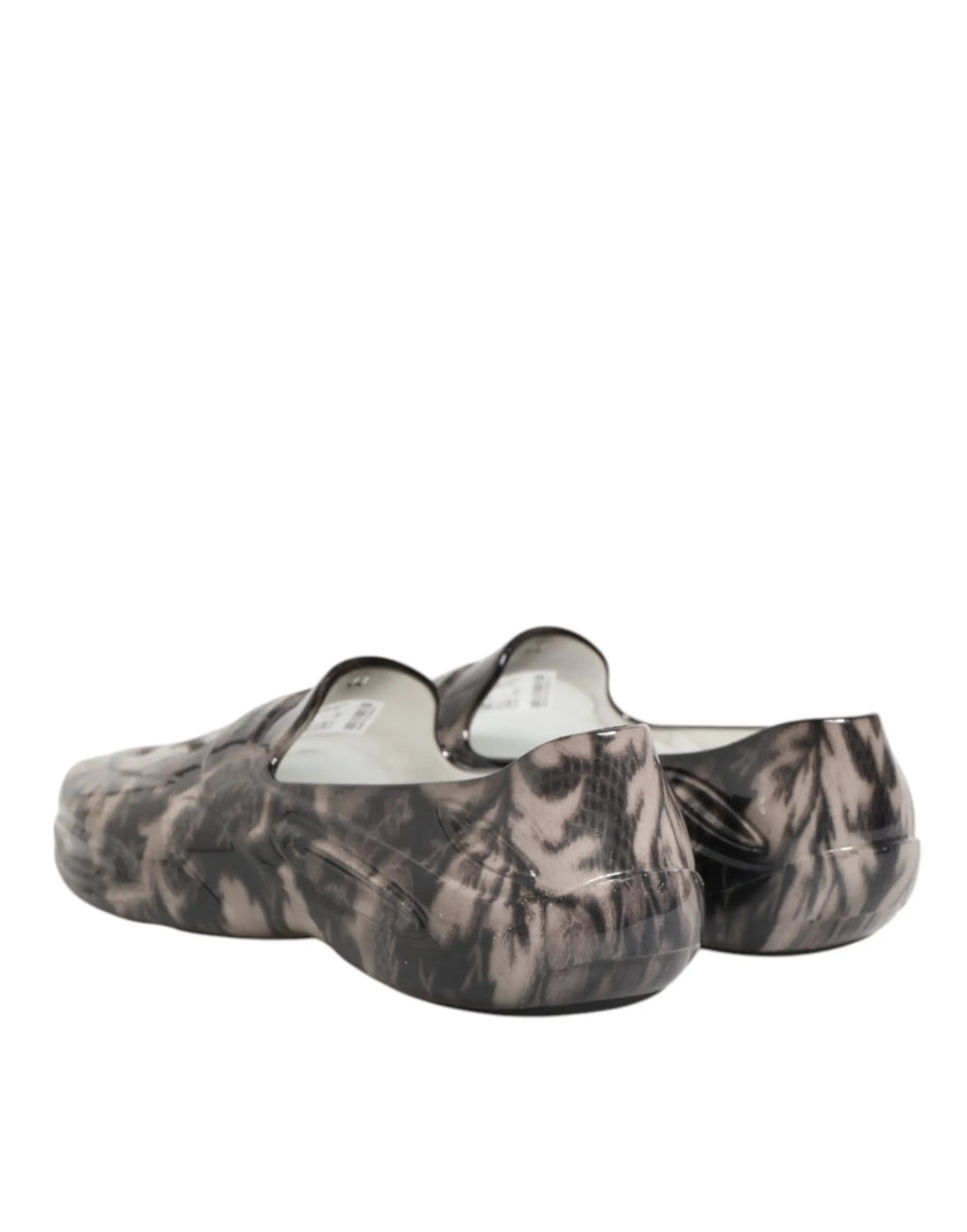 Une paire de baskets basses dolce & gabbana pour homme en caoutchouc multicolore avec motif tie and dye noir et gris translucide brillant