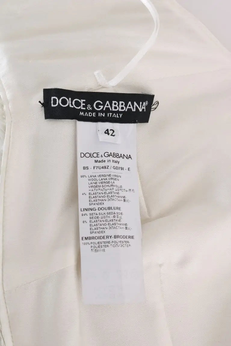 Étiquette blanche dolce & gabbana avec logo noir et détails multilingues sur la composition du bustier stretch multicolore à sequins