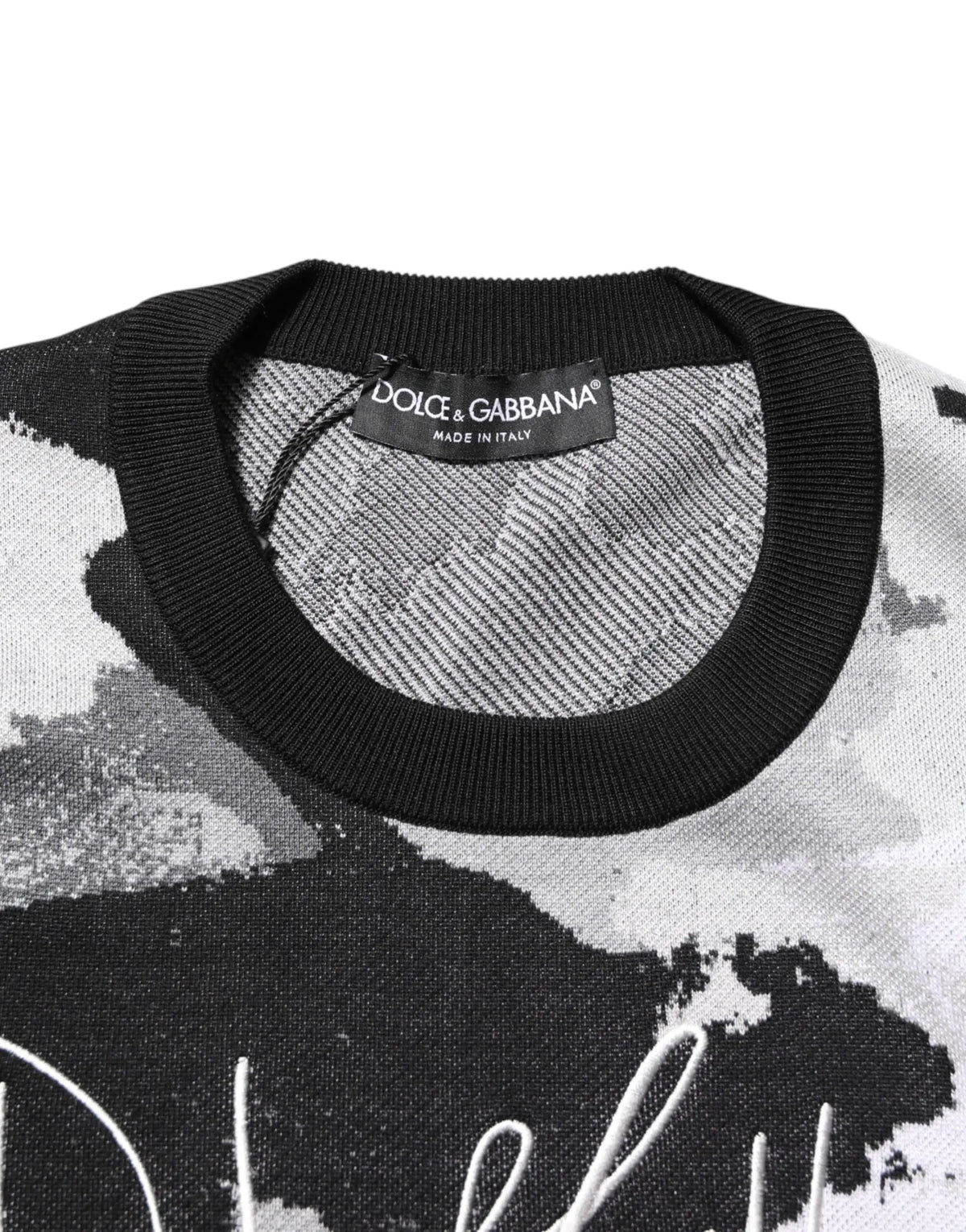 Pull en maille imprimé abstrait noir et blanc avec col rond côtelé dolce & gabbana