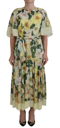 Robe midi fluide jaune à fleurs avec feuilles vertes manches froncées jupe à volants et ceinture assortie en soie dolce gabbana