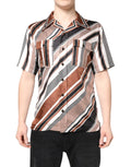 Chemise à manches courtes en soie dolce & gabbana avec rayures diagonales audacieuses marron noir et blanc