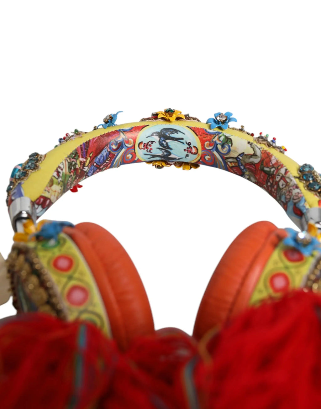Vibrant yellow and red dolce & gabbana headphones with floral patterns, metallic embellishments, and crystal tassels