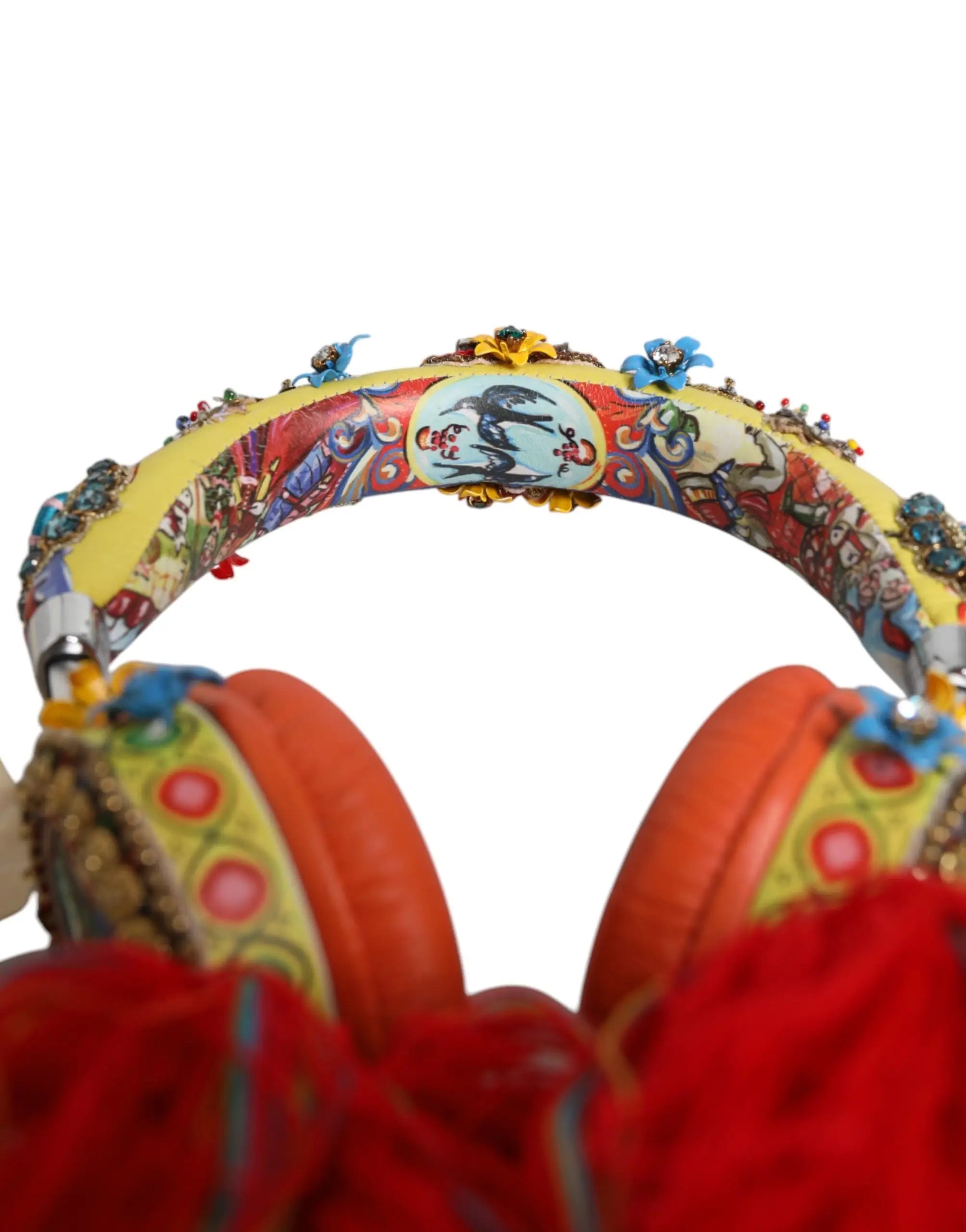 Vibrant yellow and red dolce & gabbana headphones with floral patterns, metallic embellishments, and crystal tassels