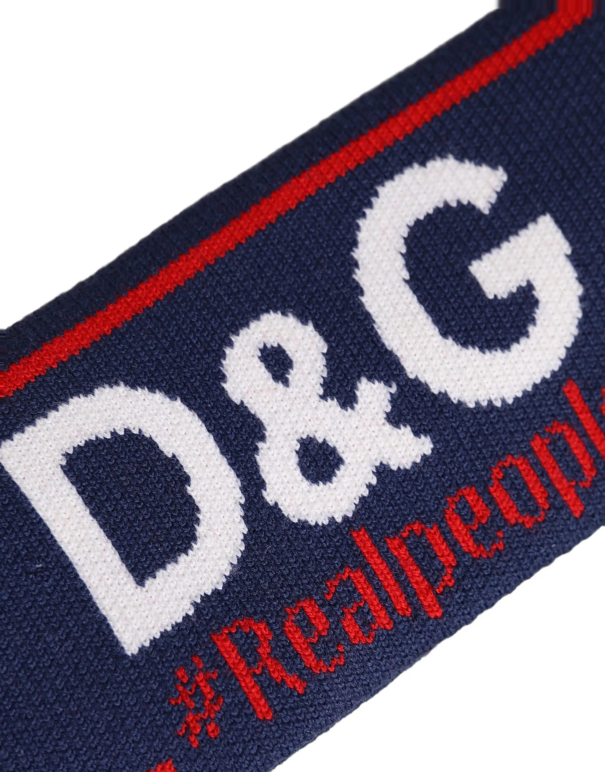 Écharpe en laine marine de dolce & gabbana avec logo d&g blanc et texte rouge realpeople sur le bord