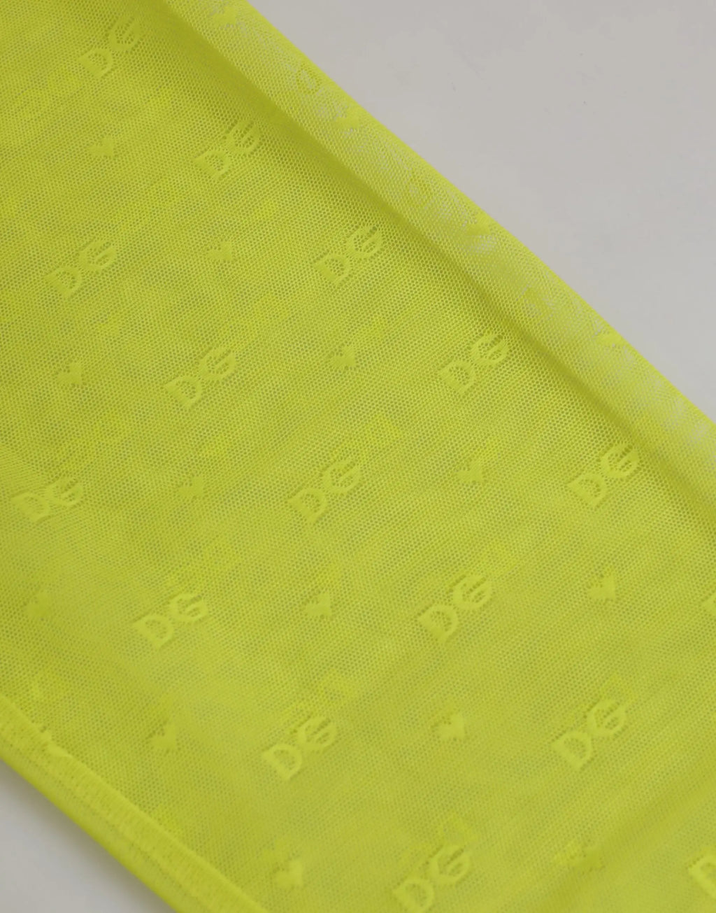 Tissu translucide jaune néon avec motif logo embossé d&g pour leggings en nylon dentelle dolce gabbana
