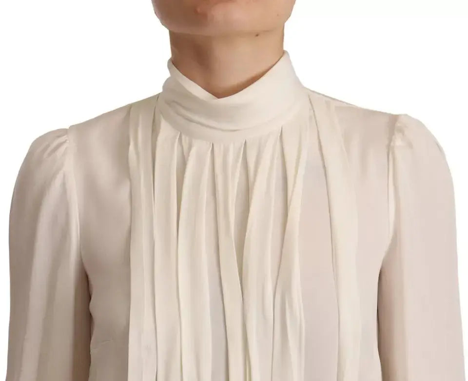 Blouse en soie crème dolce gabbana à col roulé haut avec plis verticaux sur le devant
