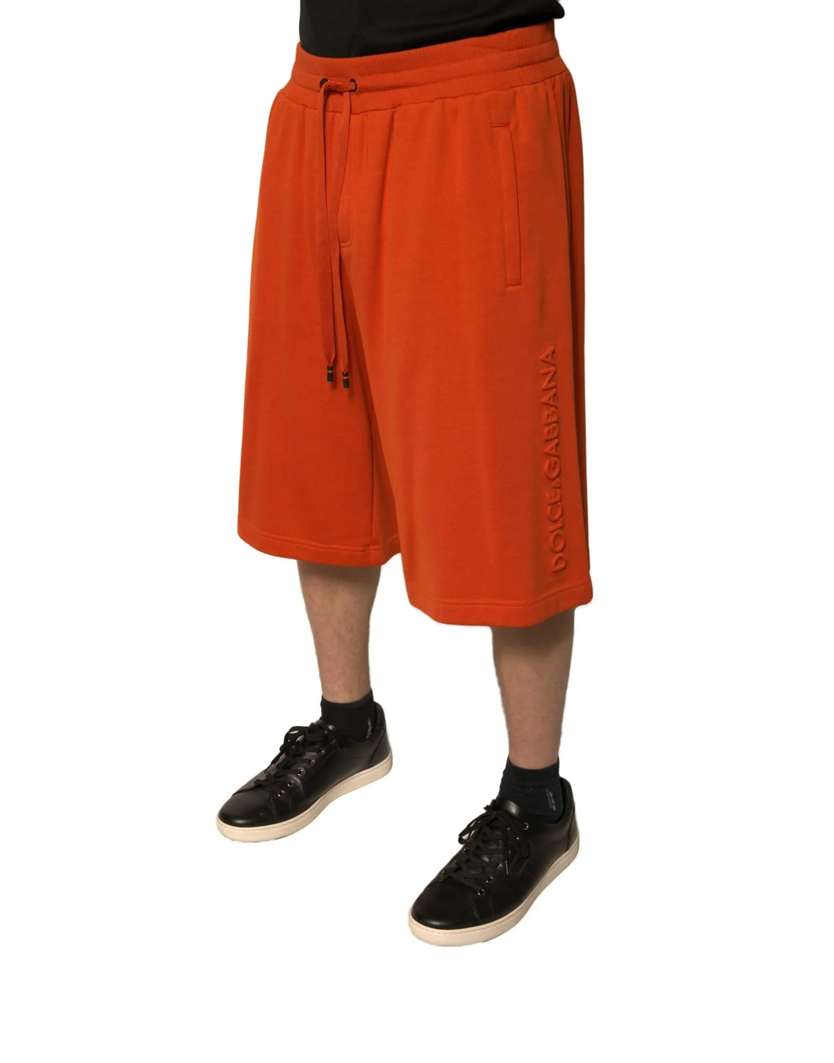 Bermuda orange dolce & gabbana pour homme en mélange de coton avec tissu texturé et branding vertical côté