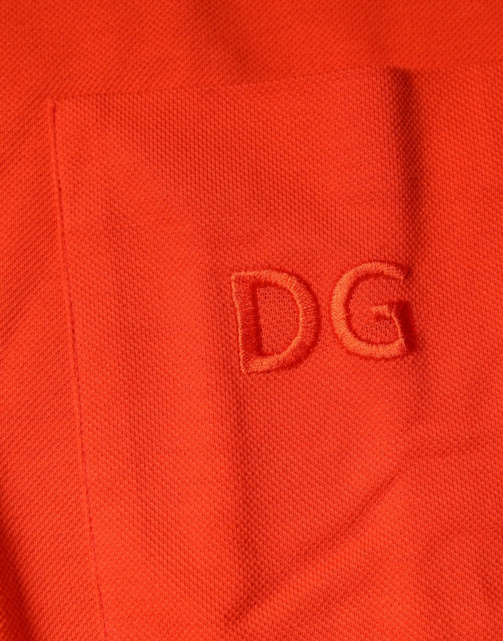Polo décontracté dolce & gabbana orange en coton avec tissage texturé subtil et logo dg brodé sur la poche poitrine