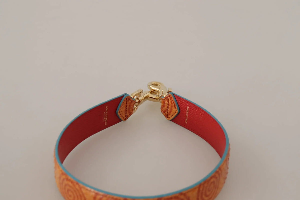 Bracelet en cuir orange dolce & gabbana avec fermoir doré et motif spirale embossé sur sangle d’épaule