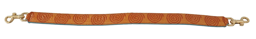 Orange leather strap with spiral pattern and gold-tone clasps for dolce & gabbana swirl print bag shoulder strap