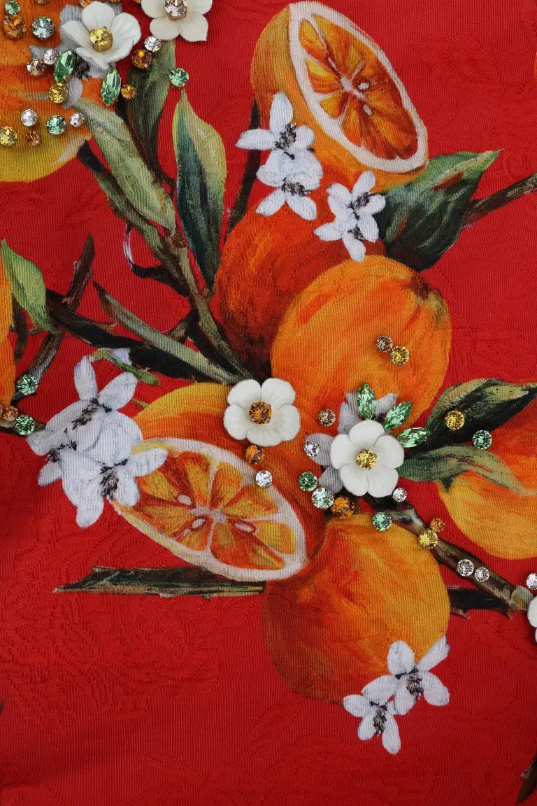 Blouse dolce gabbana rouge vif avec imprimé orange et fleurs blanches ornée de cristaux scintillants