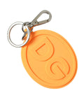 Dolce & gabbana porte-clés rond orange en silicone avec logo dg embossé et attache en métal argenté