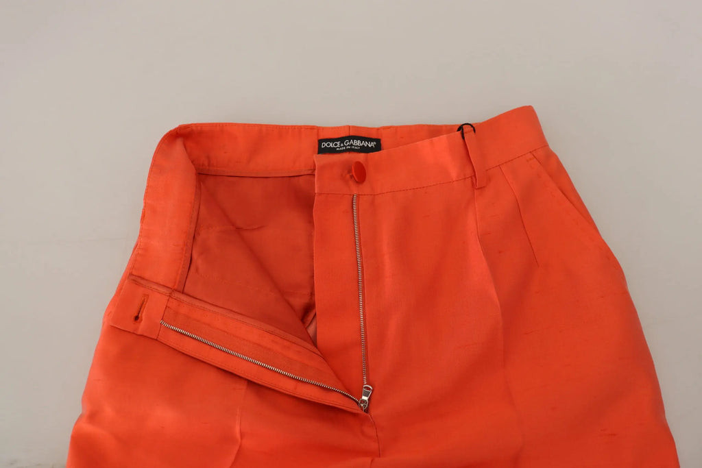 Pantalon court taille haute en soie orange de dolce gabbana avec coupe ajustée et détails de fermeture éclair dorés
