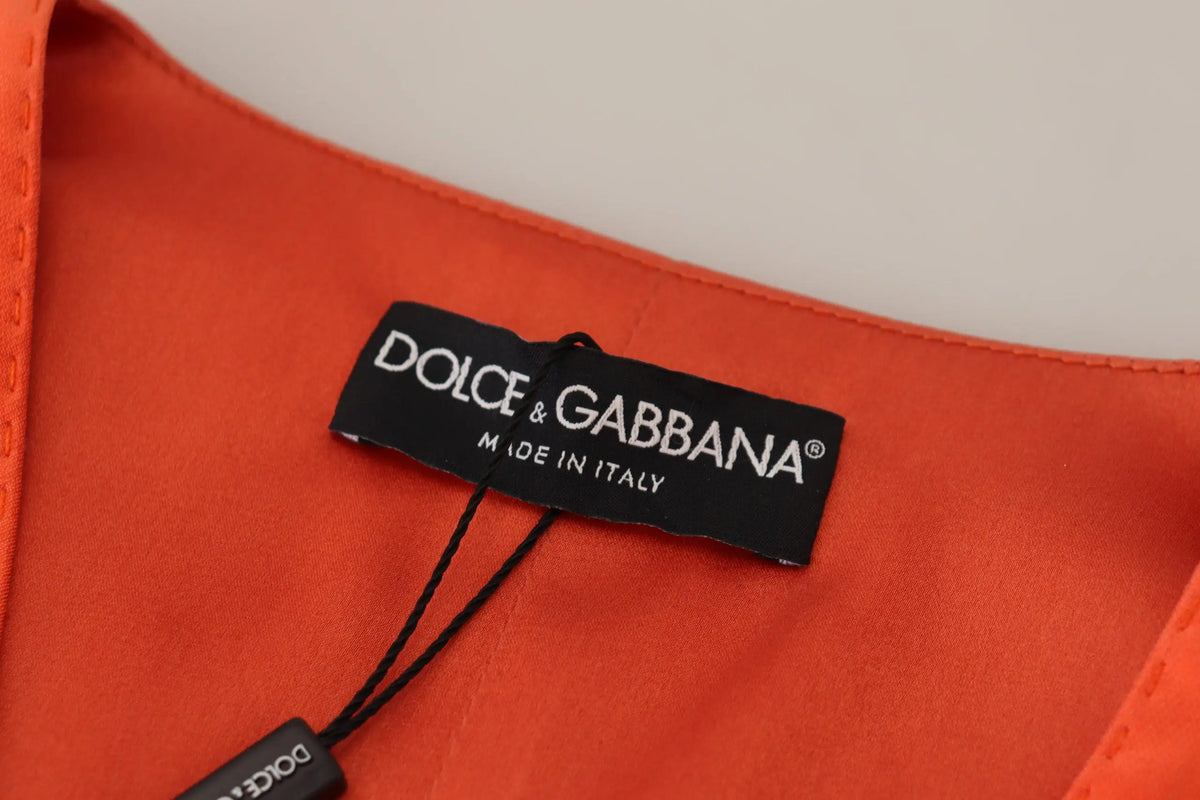 Étiquette orange vive dolce & gabbana sur tissu noir avec lettrage blanc made in italy pour veste courte sans manches