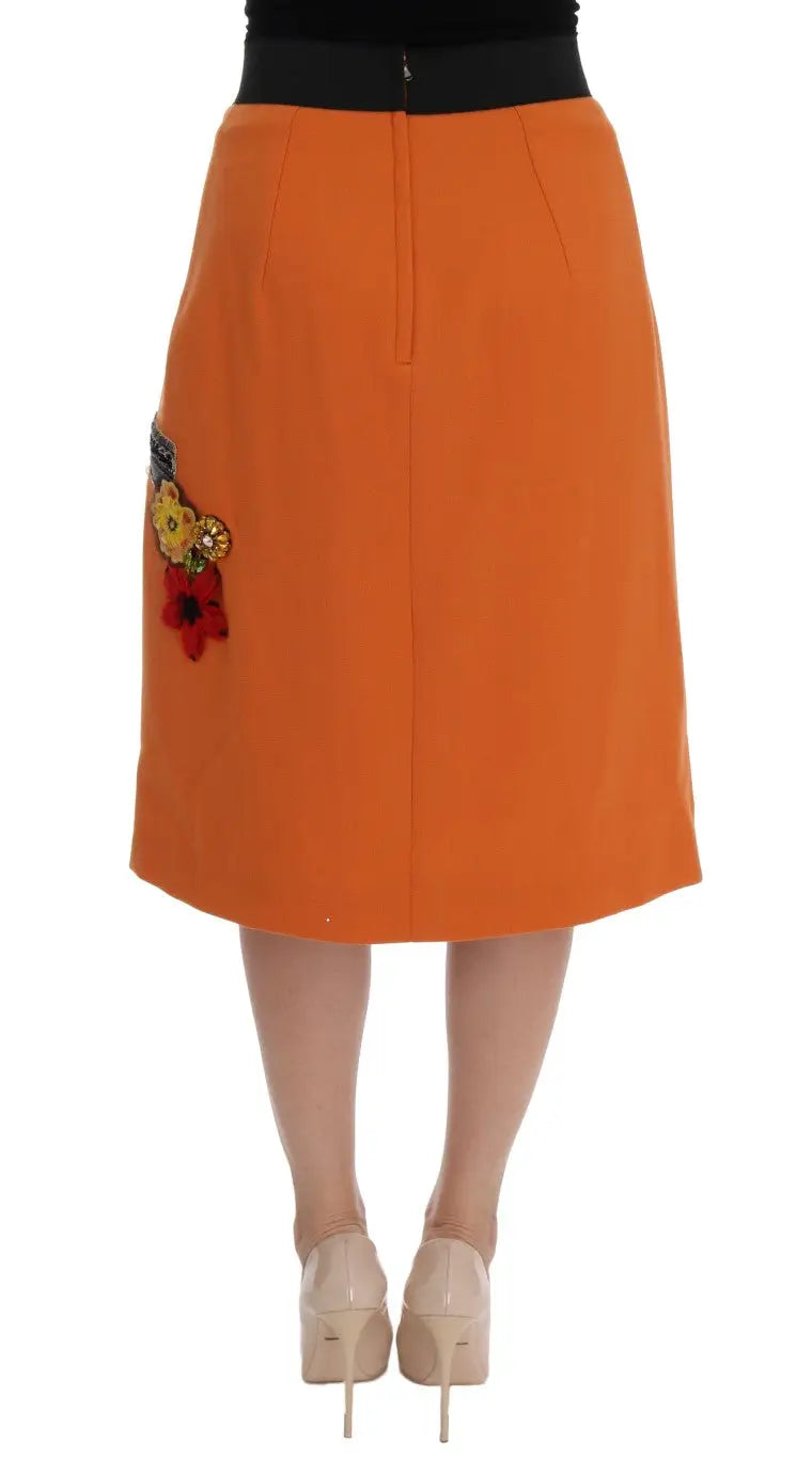 Jupe orange mi-cuisse dolce et gabbana en laine avec taille noire et applications florales en cristal et sequins
