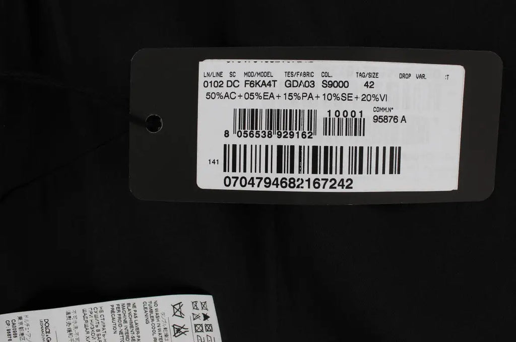Étiquette noire au dos d’une robe longue dolce & gabbana rose imprimé floral avec informations produit et code-barres