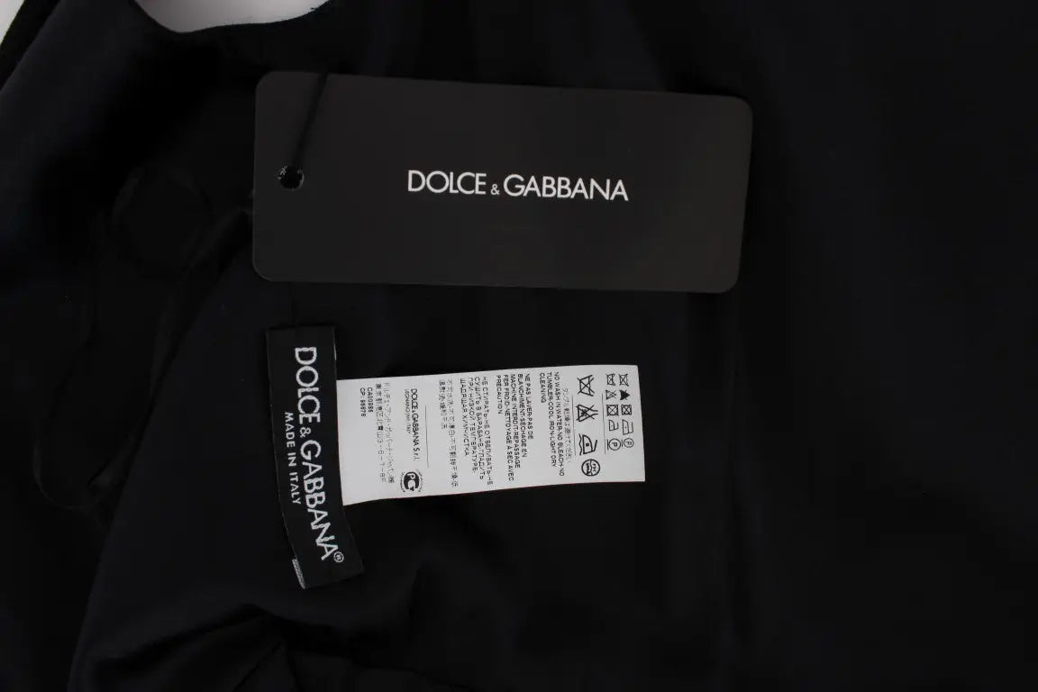 Étiquette noire dolce gabbana avec branding blanc et instructions d entretien pour robe longue rose à imprimé floral