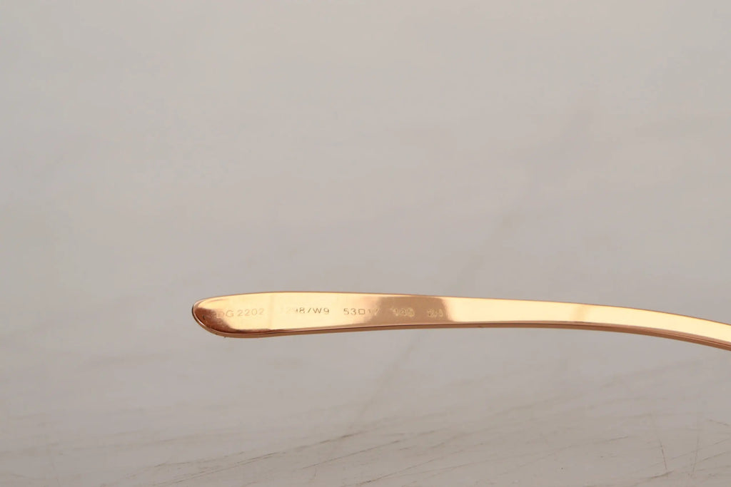 Poignée de cuillère en métal rose gold lisse et gravée associée aux lunettes dolce & gabbana pink gold rose dg2202